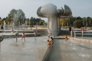 Children cooling off in a summer fountain during a Detroit heat wave